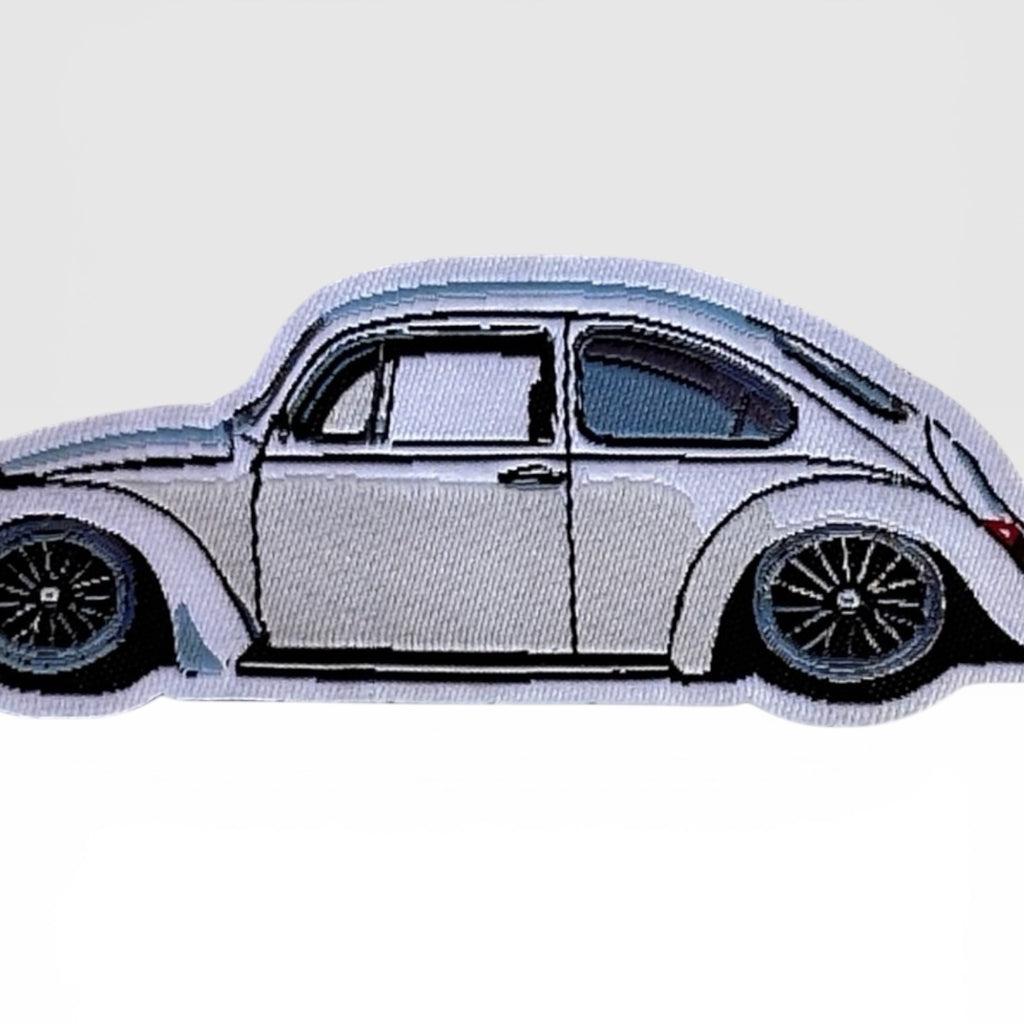 Close-up of Super Beetle Frunk Club woven patch for jackets, hats, bags, and garage gear