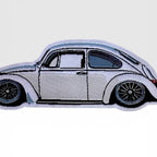 Close-up of Super Beetle Frunk Club woven patch for jackets, hats, bags, and garage gear