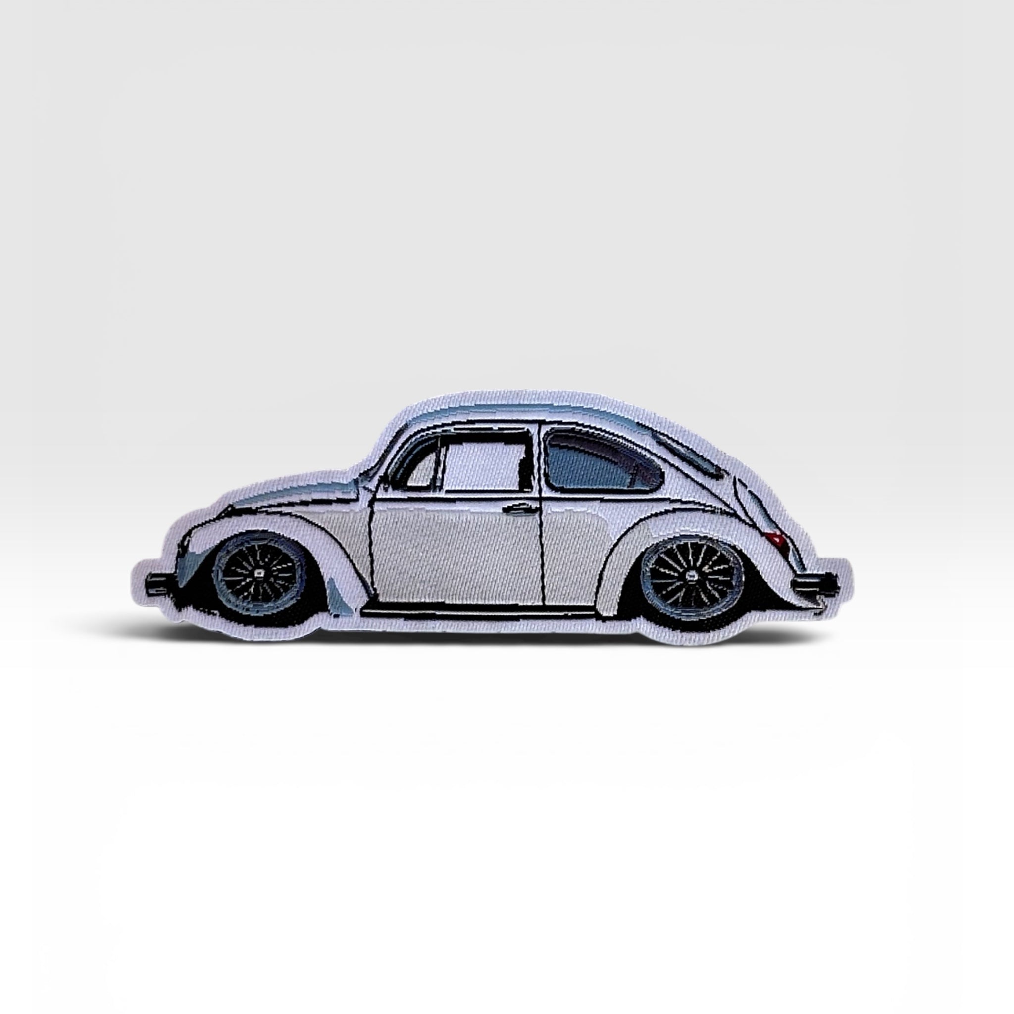 Classic front-trunk Super Beetle woven patch displayed for custom Frunk Club bundles