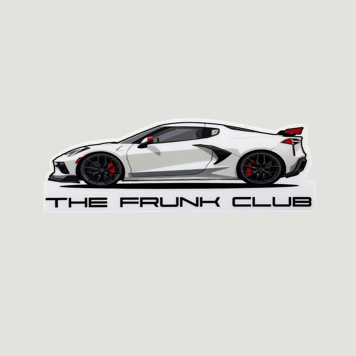 The Frunk Club white C8 Corvette mid-engine sports car die-cut vinyl sticker with black accents and red brake calipers.