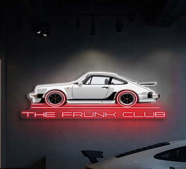 The Frunk Club white neon wall art sign featuring a C8 Corvette silhouette with red wheels and red branding.