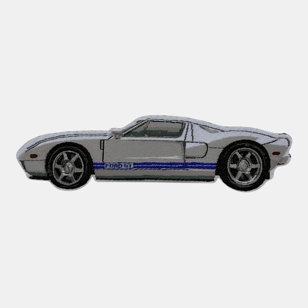 The Frunk Club Ford GT woven patch, white with blue racing stripes and "FORD GT" text.