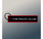 The Frunk Club embroidered key tag with red border and silver lettering, attached to a keyring.