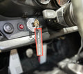 The Frunk Club embroidered key tag with red border and silver lettering, attached to car keys.