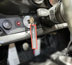 The Frunk Club embroidered key tag with red border and silver lettering, attached to car keys.