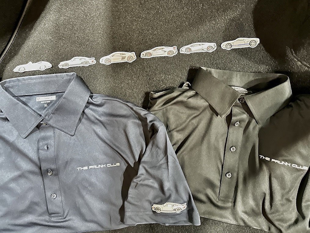 The Frunk Club charcoal grey performance polo shirt with classic collar and subtle branding. Breathable, moisture-wicking fabric.