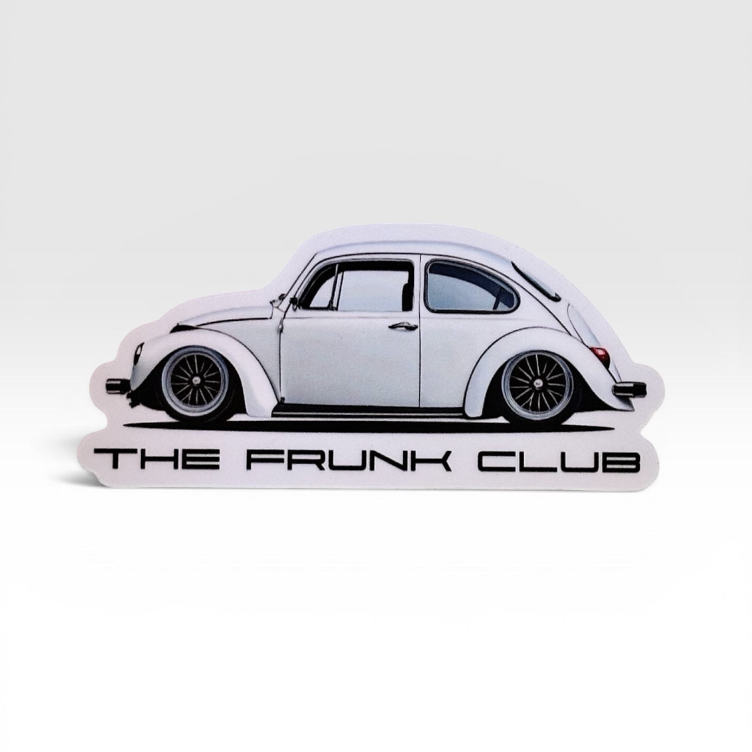 The Frunk Club white Super Beetle sticker, 4-inch die-cut vinyl with custom wheels and lowered stance.