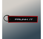 The Frunk Club black embroidered key tag with red border and silver 'FRUNK IT' lettering.