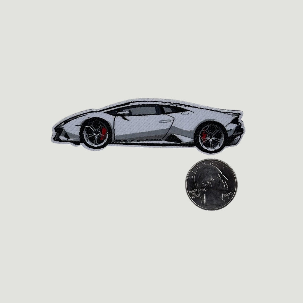 The Frunk Club white Lamborghini woven patch with red brake calipers and black wheels. Heat-transfer construction.