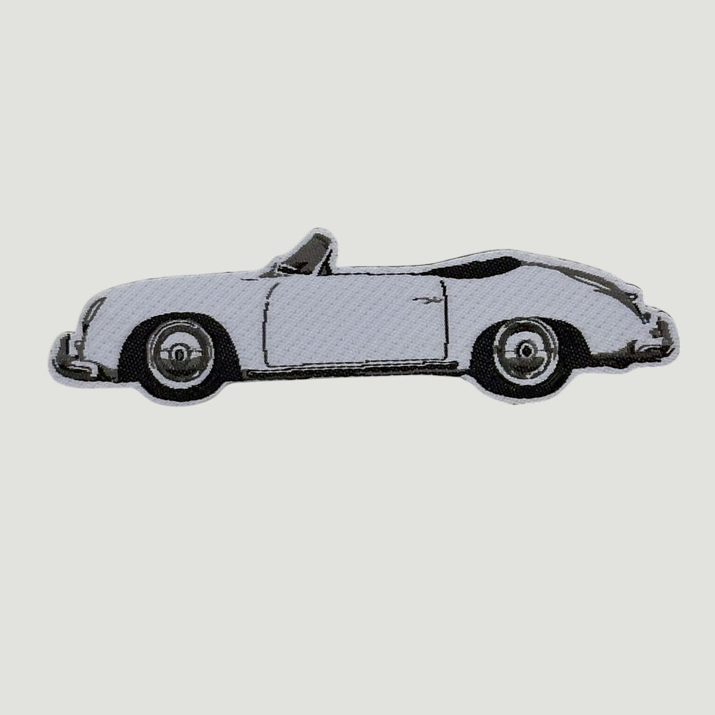 The Frunk Club woven patch featuring a white convertible car with black accents. Heat-transfer backing.
