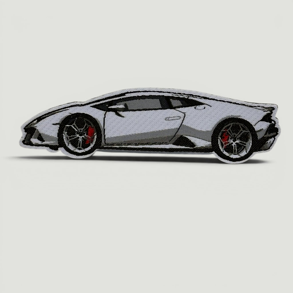 The Frunk Club white Lamborghini embroidered patch with red brake calipers and black rims.