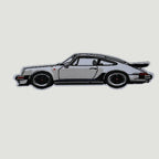 The Frunk Club woven patch featuring a white Porsche 930 Turbo car with black wheels and a rear spoiler.