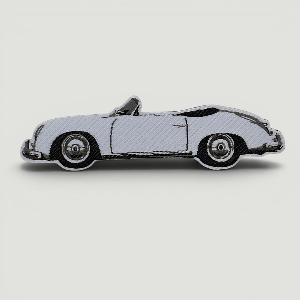 The Frunk Club embroidered patch of a white convertible Porsche 356 Speedster.